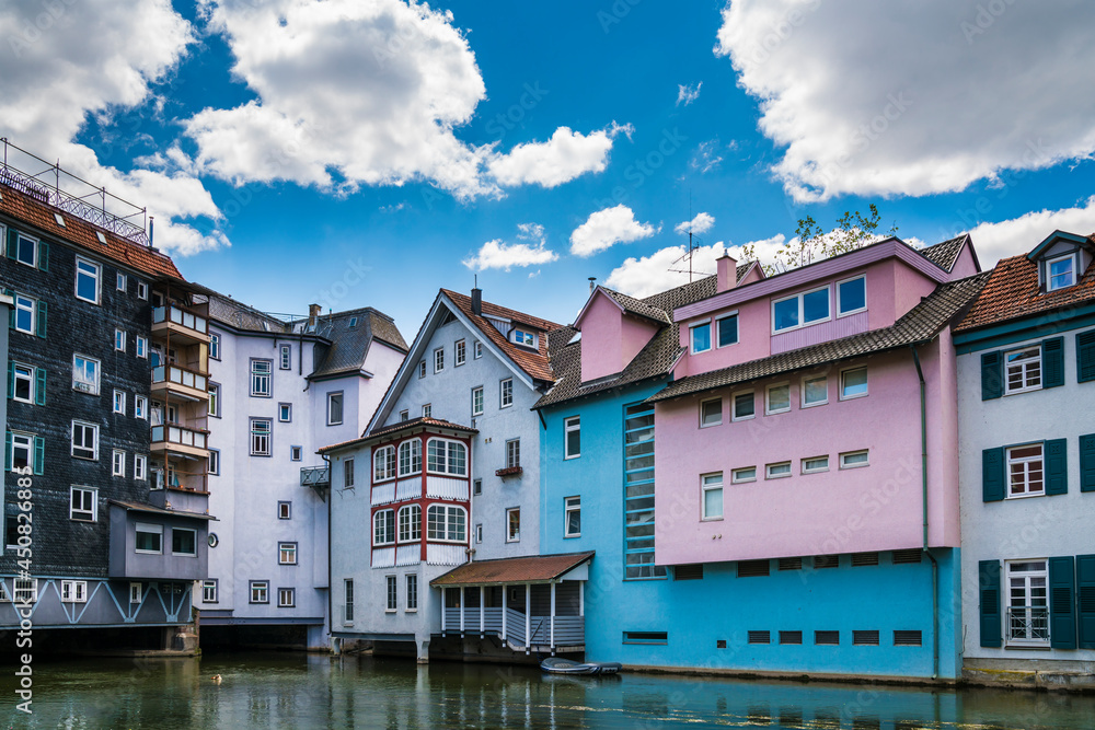 Germany, Esslingen am neckar, little venice, colorful houses along riverside of neckar river with a rubber boat in summer