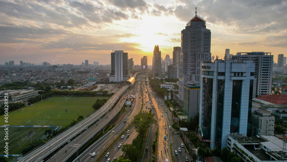 Aerial view of Panoramic photo of Jakarta overlooking Parklands, and the city skyline with a spectacular sunset. Jakarta, Indonesia, August 13, 2021