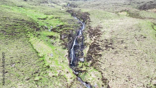 Aerial view of a waterfall in the mountains near Crolly in County Donegal - Ireland photo