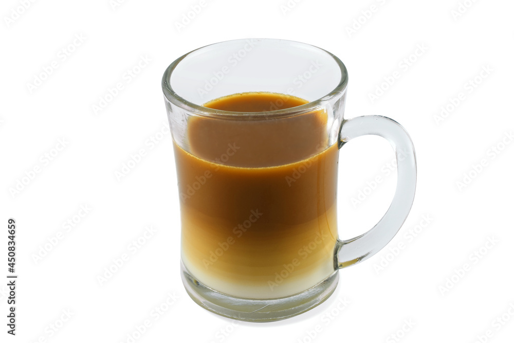 Two layers of milk coffee in a transparent glass, perspective view, isolated on a white background Two layers of milk coffee in a transparent glass, perspective view, isolated on a white background