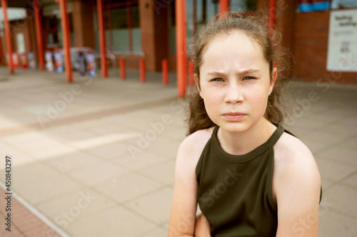 Wallpaper Mural Young thoughtful teen age girl looking at camera, outdoor portrait of a sad girl Torontodigital.ca