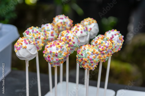 Tasty cookie lolly with colorful sugar sprinkles as delicious snack and party catering on birthday party or as yummy decoration for kids and children and idea for cakes and cookies with sugar topping