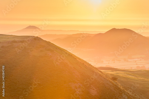 Warm yellow sunrise in Shropshire Hills, UK