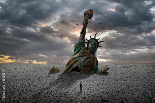 Statue of Liberty half buried in the sand 