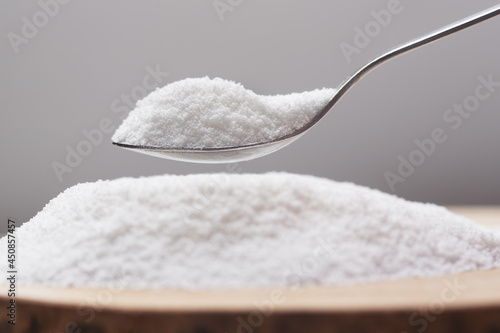 Spoon with natural sweetener stevia on a heap