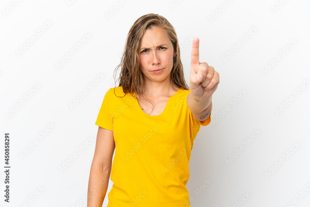 Young caucasian woman isolated on white background counting one with serious expression Young caucasian woman isolated on white background counting one with serious expression
