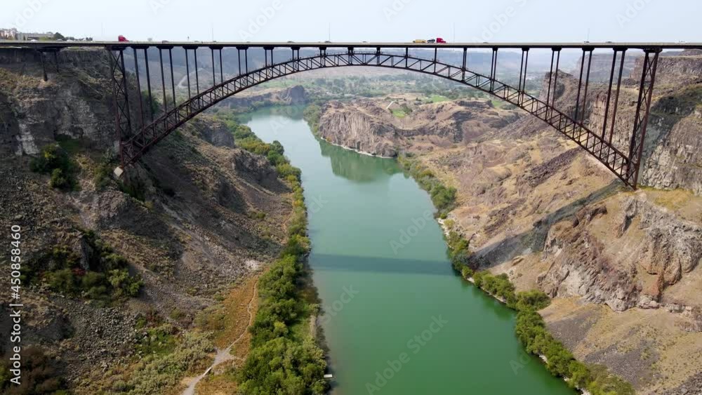 Aerial view of the Perrine Memorial Bridge over the snake river in Twin Falls, Idaho. With cars driving across the bridge. Aerial view of the Perrine Memorial Bridge over the snake river in Twin Falls, Idaho. With cars driving across the bridge.