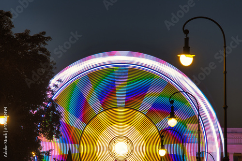 Closeup shot of Ferris wheel in Karolinenplatz in Germany with night lights photo