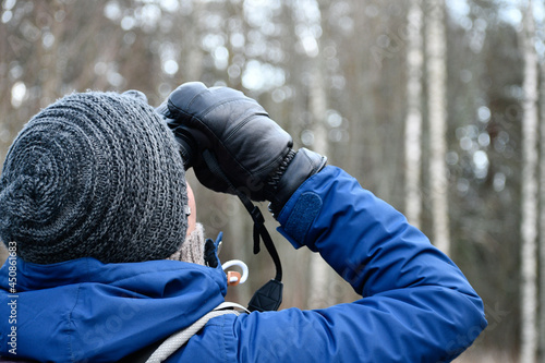Bird watcher with binoculars