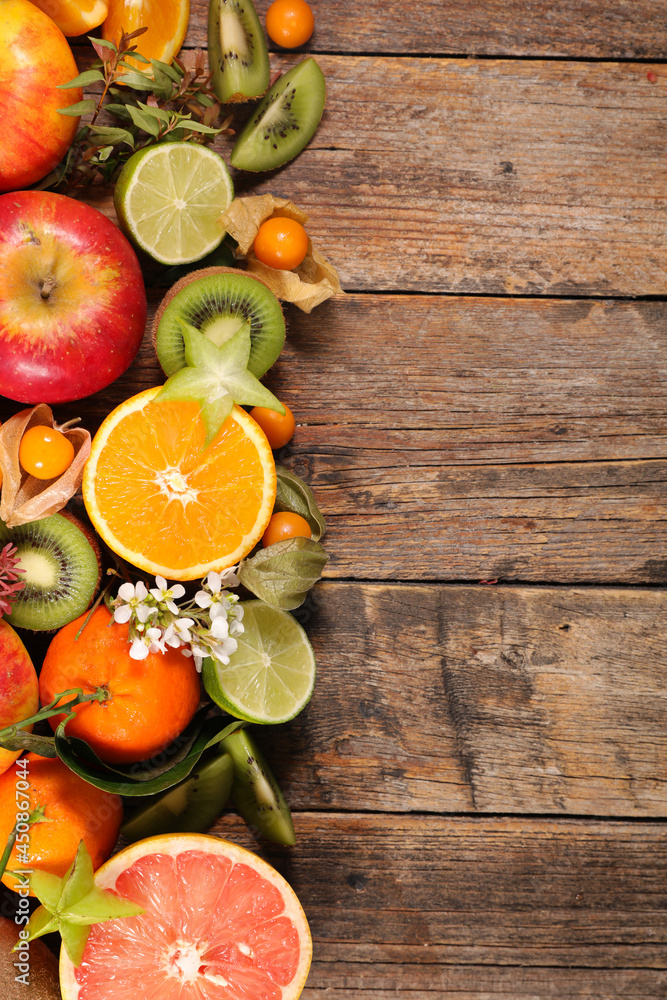 assorted of fresh fruit with orange, kiwi, apple and pomegranate assorted of fresh fruit with orange, kiwi, apple and pomegranate