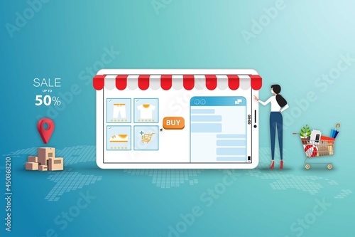 Concept of online shopping, young women wear a face mask and touch a big screen of tablet to chat with customer service to order the goods from the application in green color background.