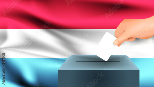 Luxembourg flag, male hand voting with Luxembourg flag concept idea background