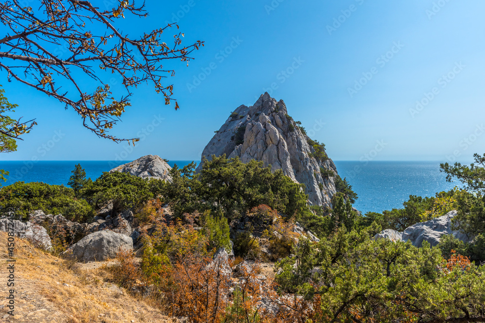 Rock Diva on beach, beautiful black sea shore landscape with mountain cliff, main nature landmark in Crimean Simeiz village