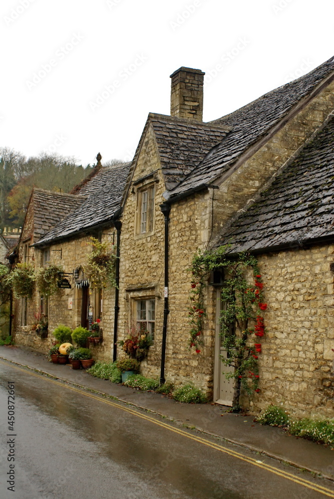 Historic homes covered in ivy in Castle Combe, England