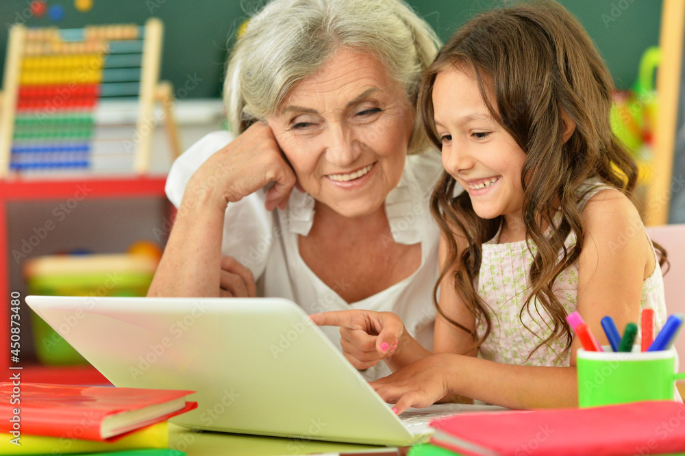 Close up portrait of happy grandmother and granddaughter Close up portrait of happy grandmother and granddaughter