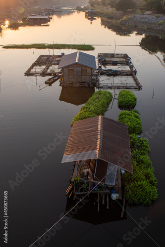 Boathouse in river at morning