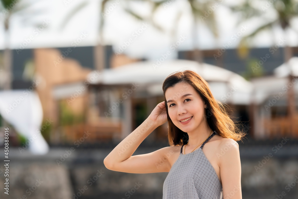 Portrait beautiful Asian woman walking at tropical beach and blue sky