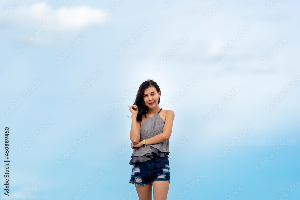 Portrait beautiful Asian woman walking at tropical beach and blue sky Portrait beautiful Asian woman walking at tropical beach and blue sky