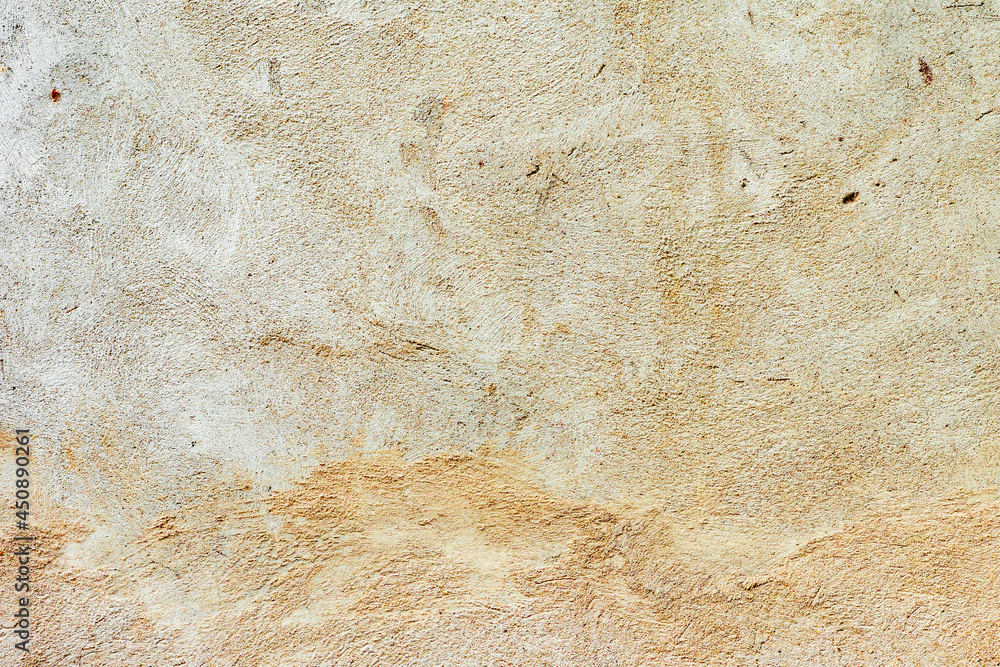 Fototapeta premium Texture of a concrete wall with cracks and scratches which can be used as a background