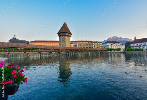 Panoramic view of Lucerne historic city center with its famous Kapellbrucke (Chapel Bridge) and lake Lucerne with Mt. Pilatus on the background photo