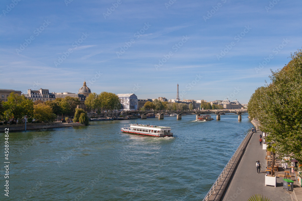 Paris, a sunny day on the Seine River embankment