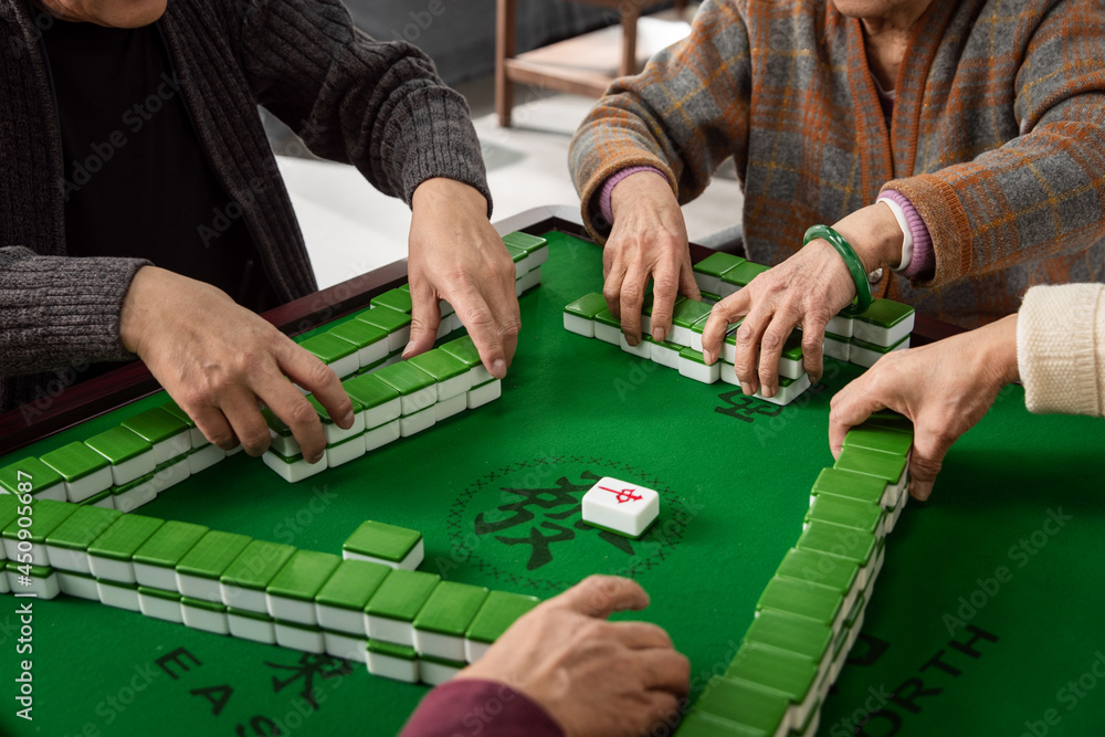 Happy old people playing mahjong
Happy old people playing mahjong