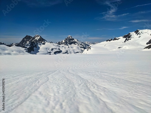 ski climbing in the Swiss mountains, winter sports on the glacier. Extreme adventure with the skis. Switzerland Snow