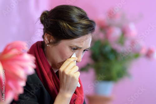 sad woman sitting near a grave