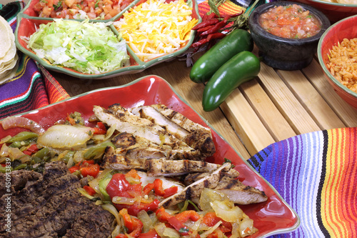 Beef and Chicken Fajita Dinner With Rice and Tortillas in Rustic Setting