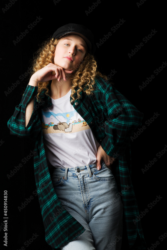 Charming girl posing keeping hand under her chin
