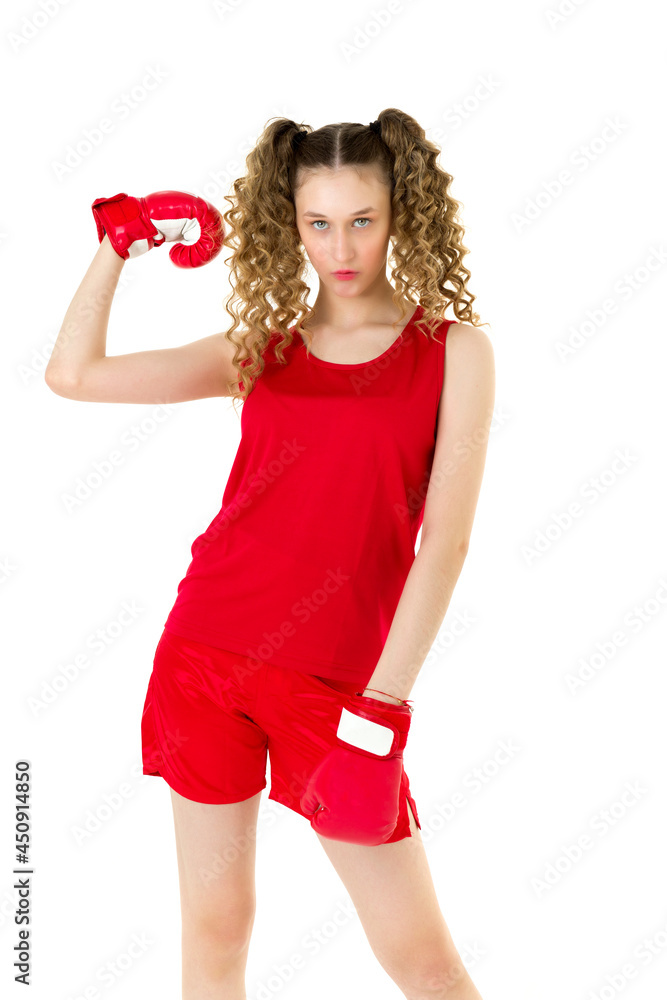 Teen girl in red boxing gloves showing her biceps Teen girl in red boxing gloves showing her biceps