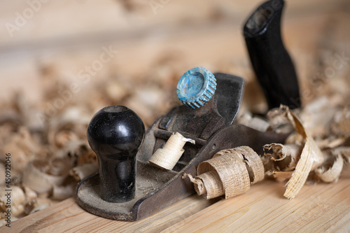 a plane among the shavings on a workbench