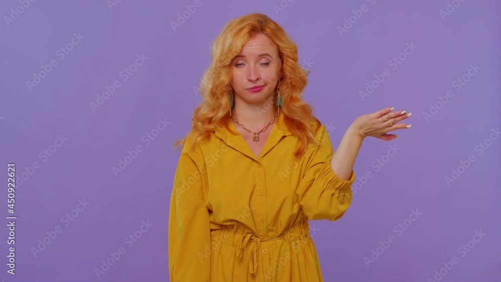 You are crazy, out of mind. Redhead girl in yellow dress pointing at camera and showing stupid gesture, blaming some idiot for insane plan. Young woman posing isolated on purple studio wall background You are crazy, out of mind. Redhead girl in yellow dress pointing at camera and showing stupid gesture, blaming some idiot for insane plan. Young woman posing isolated on purple studio wall background