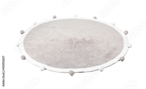 Round rug with pom poms isolated on white