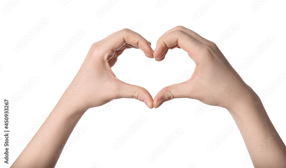 Fototapeta premium Woman making heart with her hands against white background, closeup