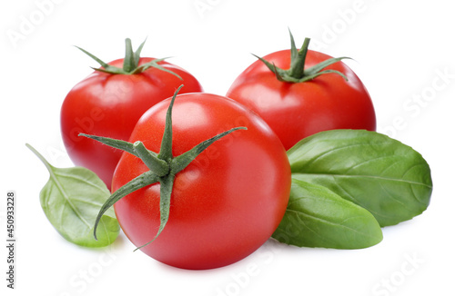 Fresh green basil leaves and tomatoes on white background