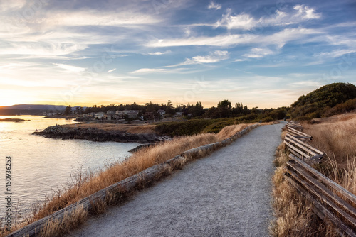 Scenic Path Trail in a Park by the Coastline on the West Pacific Ocean Coast. Summer Sunset. MacAulay Point Park in Victoria  Vancouver Island  British Columbia  Canada.