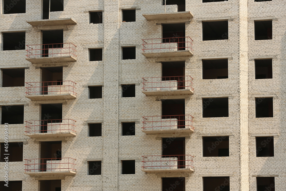 Unfinished white brick multistory building as background Unfinished white brick multistory building as background