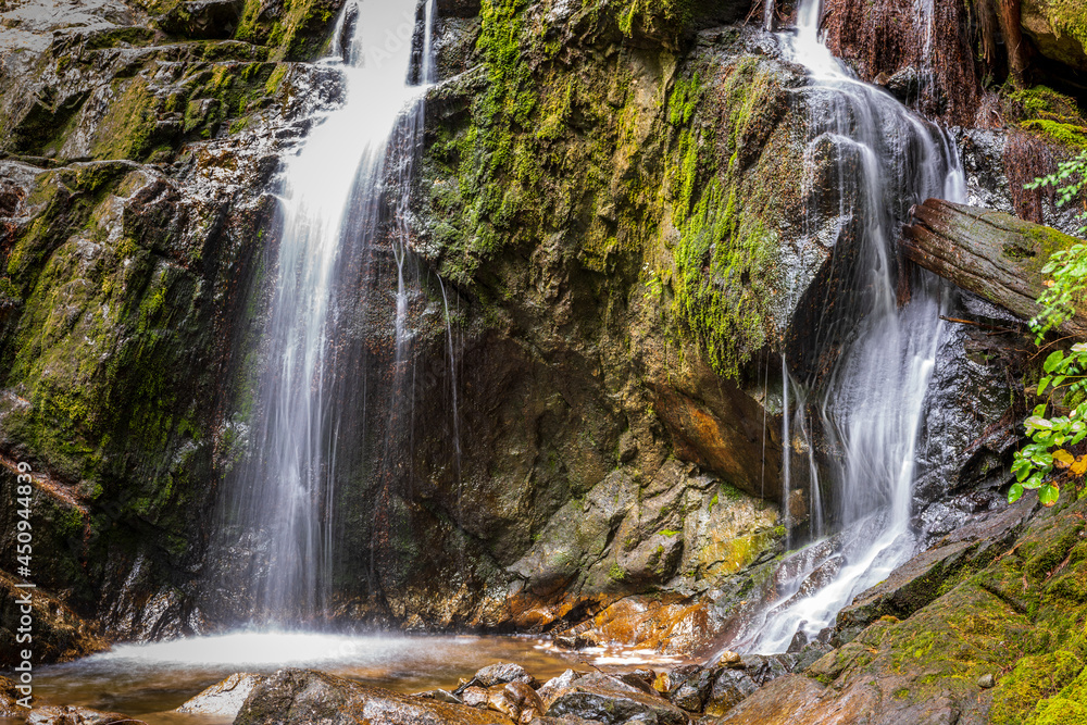 Fototapeta premium Majestic waterfall in Vancouver, Canada. View with mountain background.