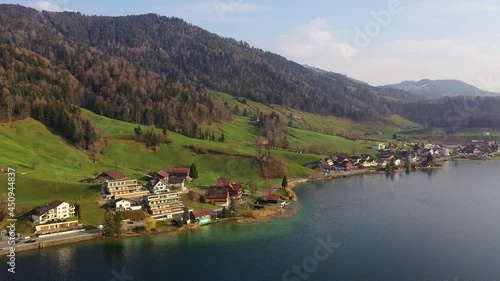 Aerial drone footage of the Morgarten village along the Ageri lake in Canton Schwyz in Switzerland. The place is famous for an historical battle in 1315 leading to the country creation.  photo