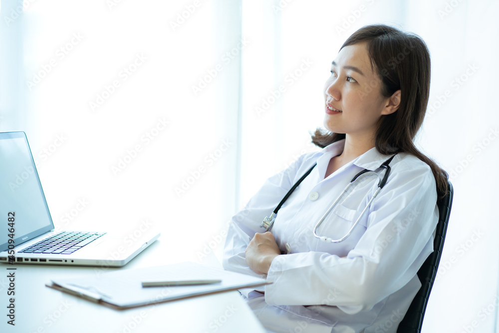Asian female doctor portrait. Doctor arranging a podcast or online steaming radio. Asian female doctor portrait. Doctor arranging a podcast or online steaming radio.