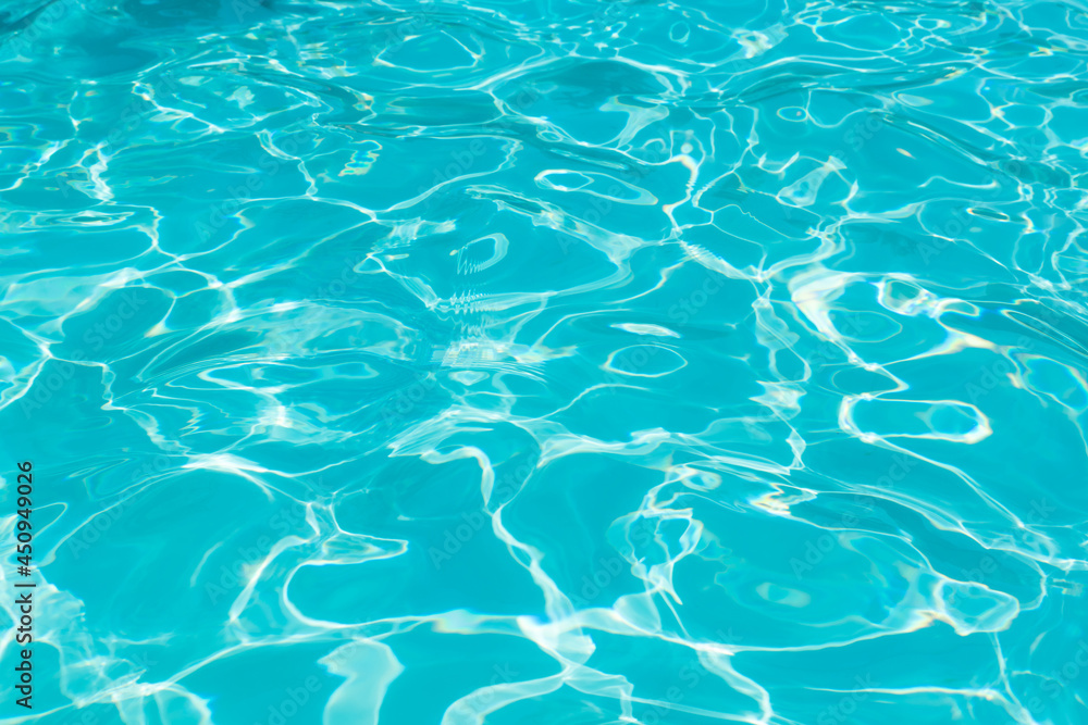 Blue water surface in swimming pool with sun reflection, Ripple wave in pool for background and abstract Blue water surface in swimming pool with sun reflection, Ripple wave in pool for background and abstract