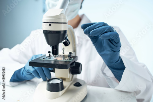 woman laboratory assistant microscope science technology professional research