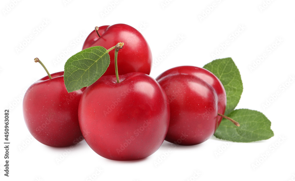 Delicious ripe cherry plums with leaves on white background Delicious ripe cherry plums with leaves on white background