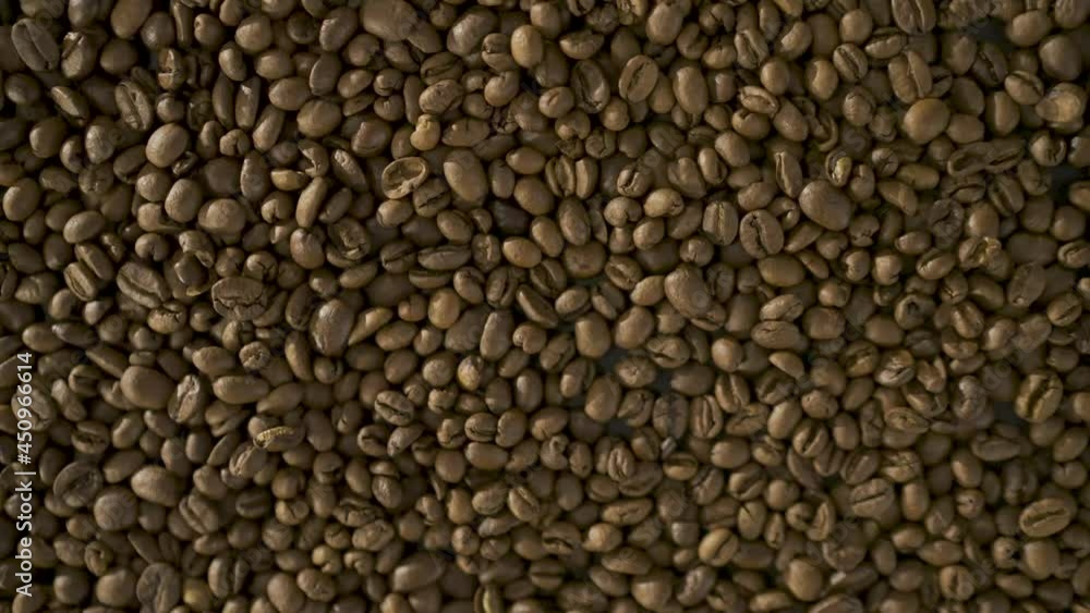 Close up of seeds of coffee. Roasted arabica coffee beans scattered on a table. Fresh coffee beans. Espresso, americano, doppio, cappuccino, latte. Robusta. Coffee Texture detail. Close up of seeds of coffee. Roasted arabica coffee beans scattered on a table. Fresh coffee beans. Espresso, americano, doppio, cappuccino, latte. Robusta. Coffee Texture detail.