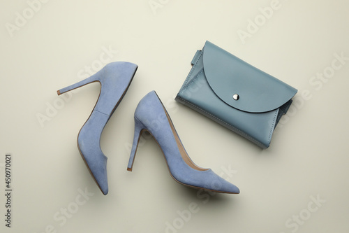 Stylish woman's bag and shoes on light background, flat lay