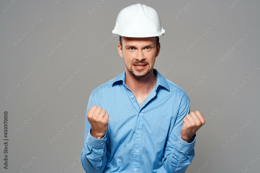 man in blue shirt engineer construction helmet safety work