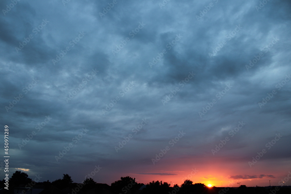 Fototapeta premium sunset clouds over the city