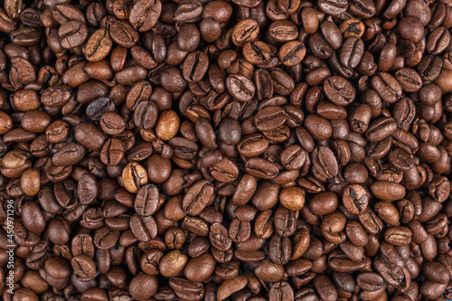 Roasted coffee beans on the table close-up. Texture. Background