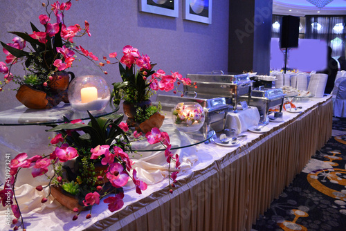 buffet party catering with lo hei yu sheng, asian and western cuisine, canapé and butler, dessert and drink halal menu for Chinese new year decoration celebrate fine dining at luxury hotel restaurant photo